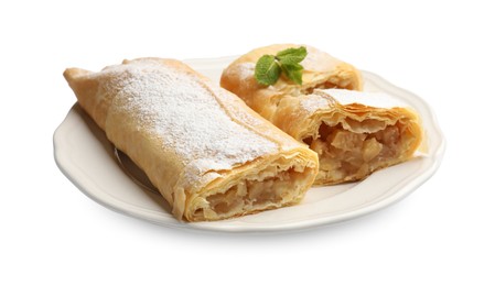 Photo of Tasty apple strudels with powdered sugar and mint isolated on white