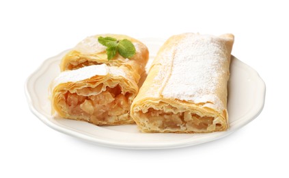 Photo of Tasty apple strudels with powdered sugar and mint isolated on white