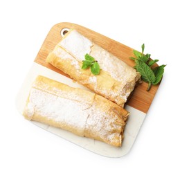 Photo of Tasty apple strudels with powdered sugar and mint isolated on white, top view