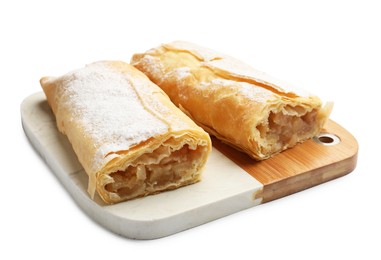 Photo of Tasty apple strudels with powdered sugar isolated on white