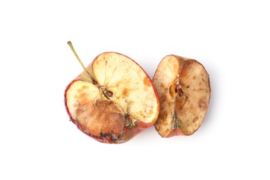 Photo of Pieces of spoiled apple isolated on white, top view