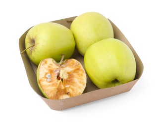Photo of Spoiled apple and good ones in box isolated on white