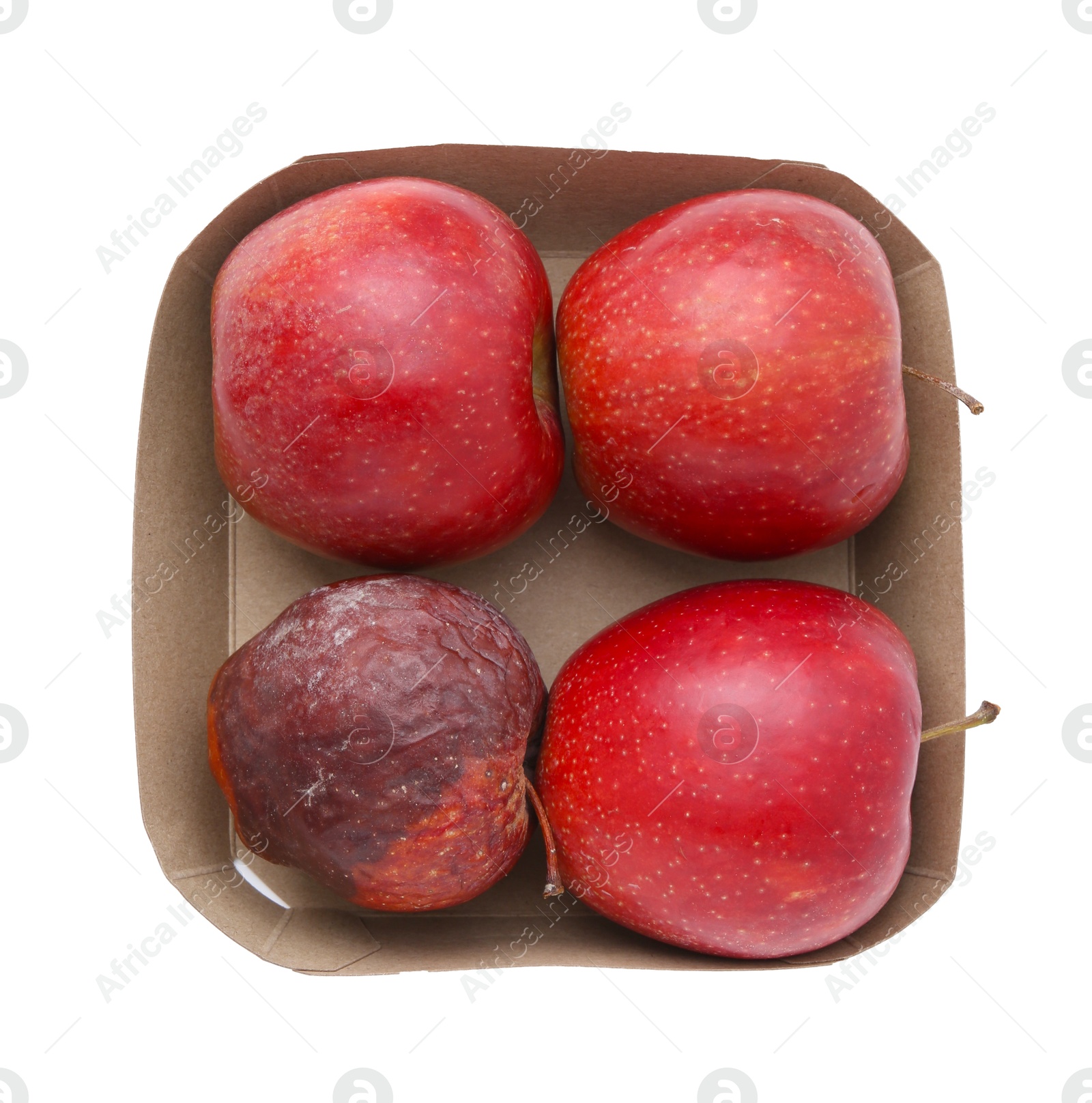 Spoiled apple and good ones in box isolated on white, top view Photo of Spoiled apple and good ones in box isolated on white, top view