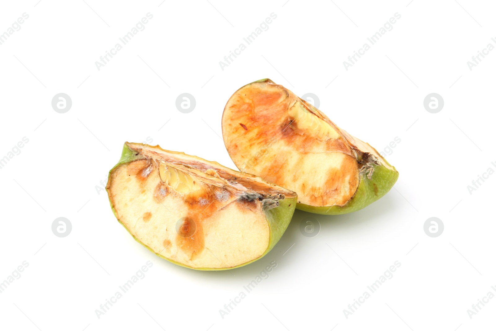 Pieces of spoiled apple isolated on white Photo of Pieces of spoiled apple isolated on white