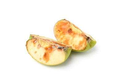 Photo of Pieces of spoiled apple isolated on white