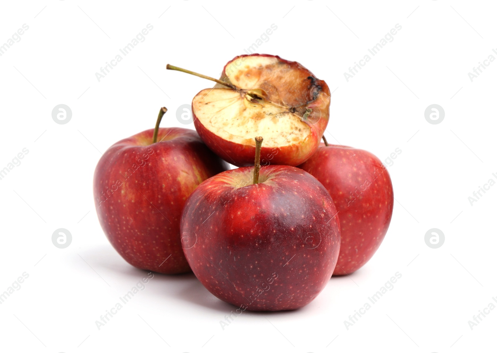 Spoiled apple and good ones isolated on white Photo of Spoiled apple and good ones isolated on white