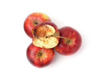 Photo of Spoiled apple and good ones isolated on white, top view