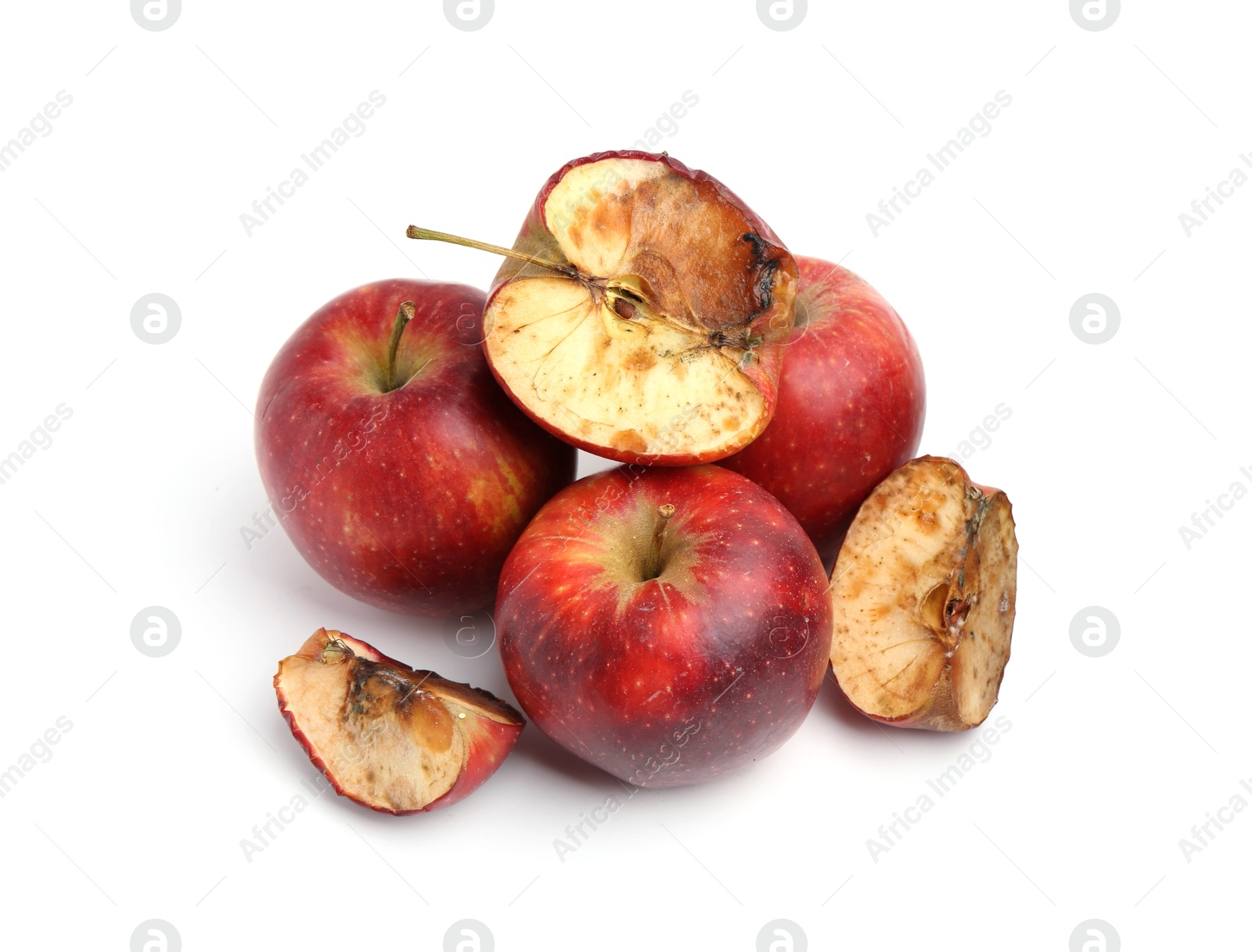 Spoiled apple and good ones isolated on white Photo of Spoiled apple and good ones isolated on white