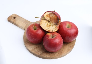 Photo of Spoiled apple and good ones isolated on white