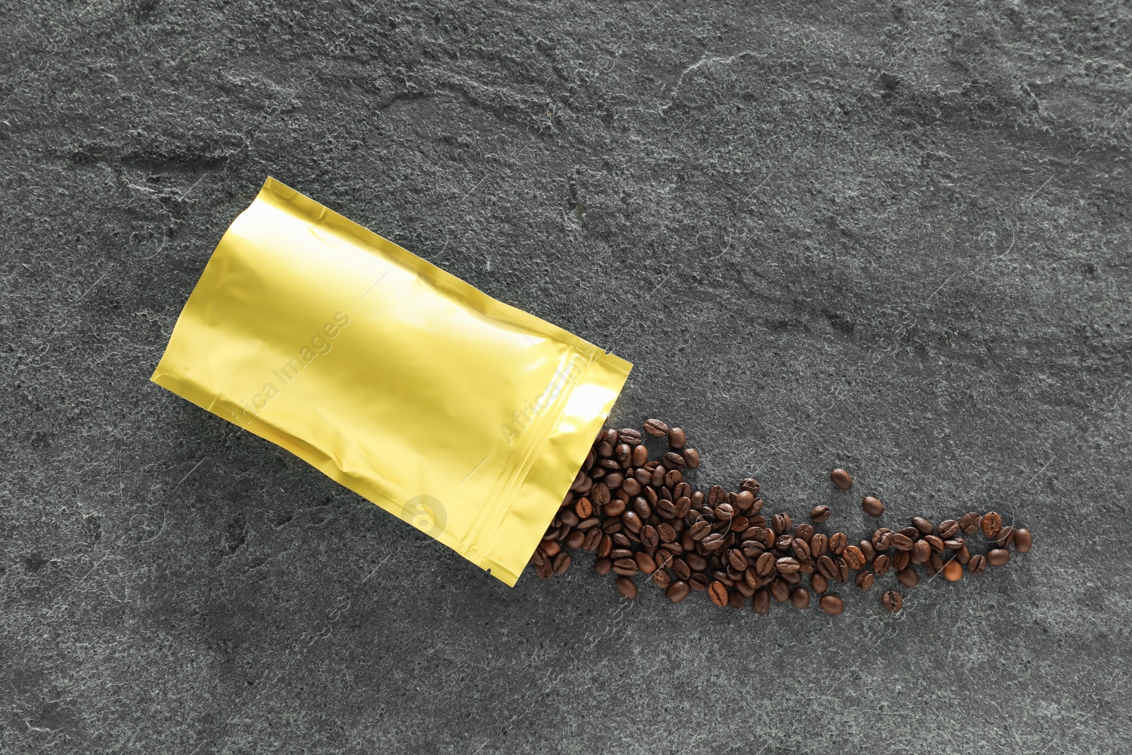 Zipper stand-up pouch and coffee beans on grey table, flat lay. Mockup for design Photo of Zipper stand-up pouch and coffee beans on grey table, flat lay. Mockup for design