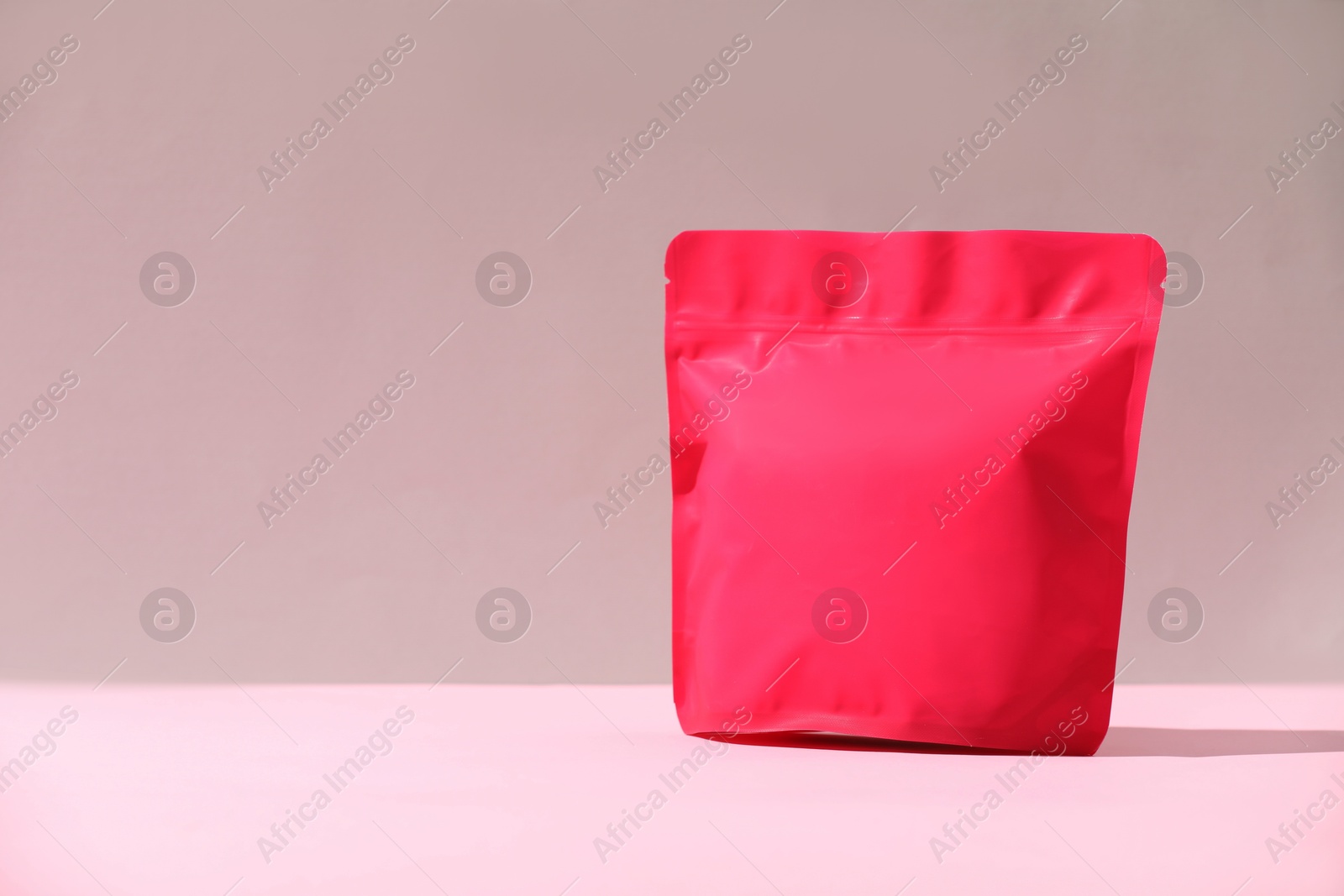 Photo of Zipper stand-up pouch on color background, mockup for design