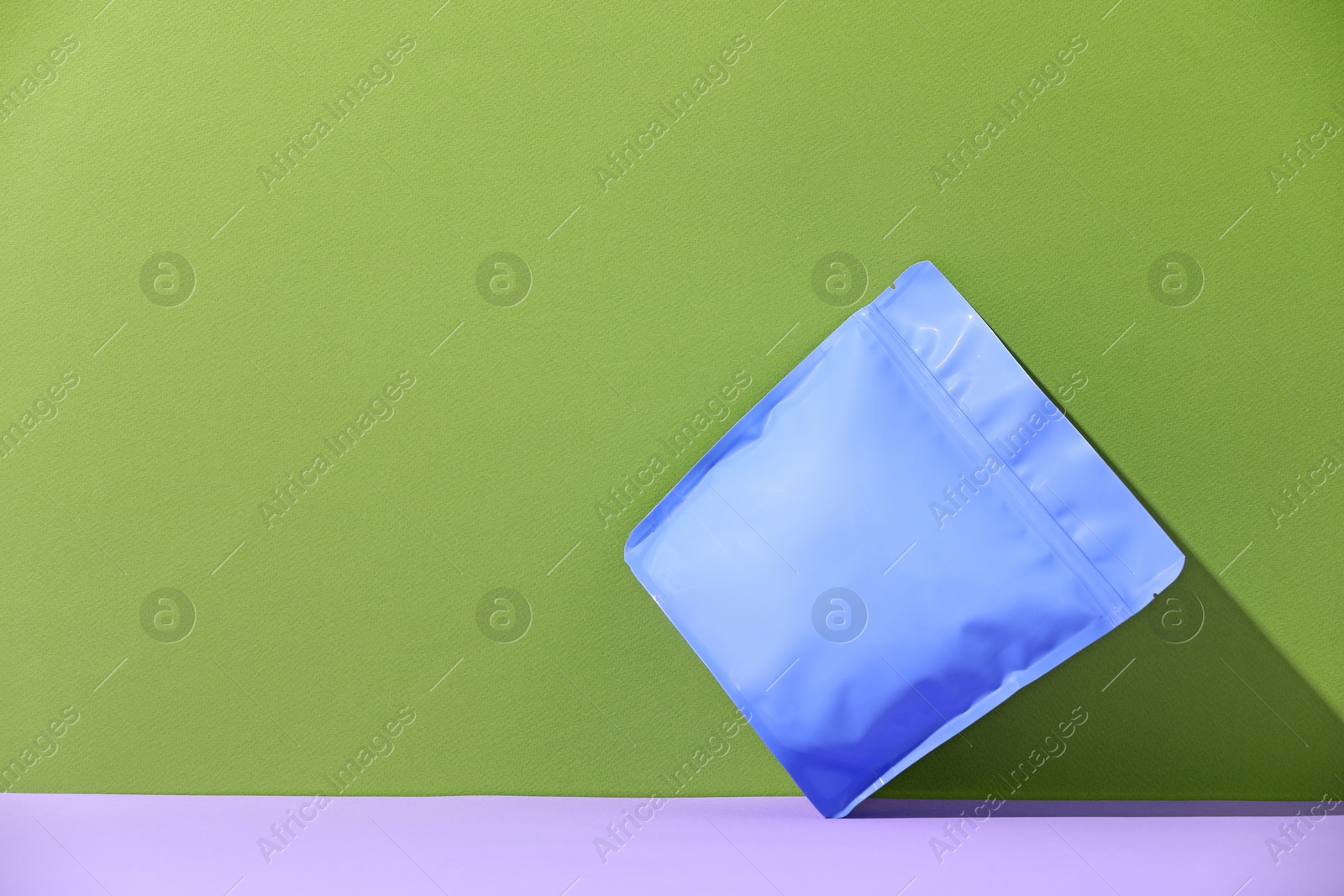 Zipper stand-up pouch on color background, mockup for design Photo of Zipper stand-up pouch on color background, mockup for design