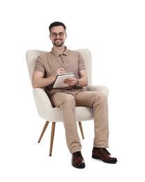 Photo of Professional psychologist with notebook in armchair on white background