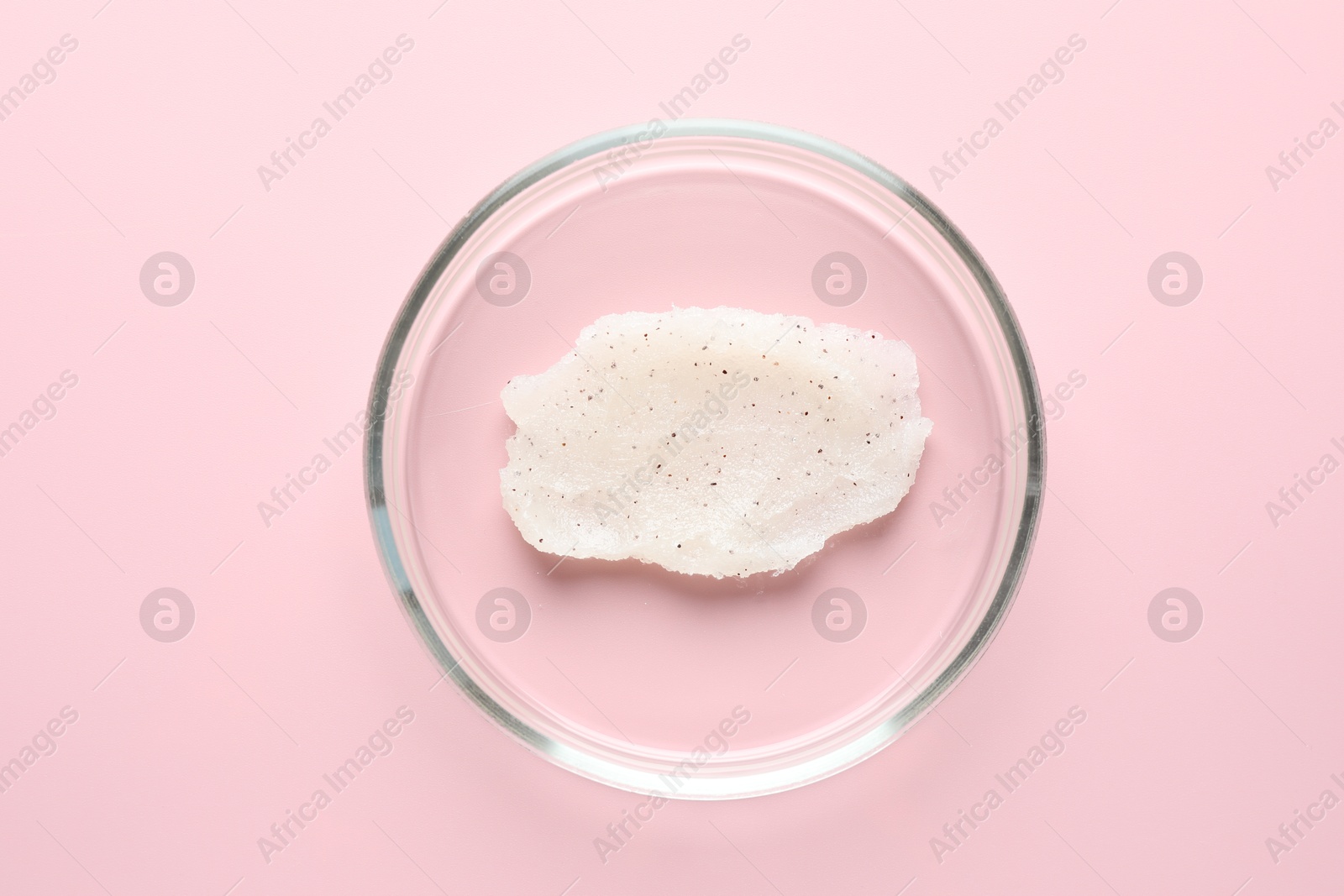 Cosmetic product in Petri dish on pink background, top view Photo of Cosmetic product in Petri dish on pink background, top view