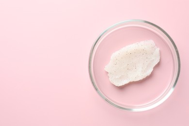 Photo of Cosmetic product in Petri dish on pink background, top view. Space for text