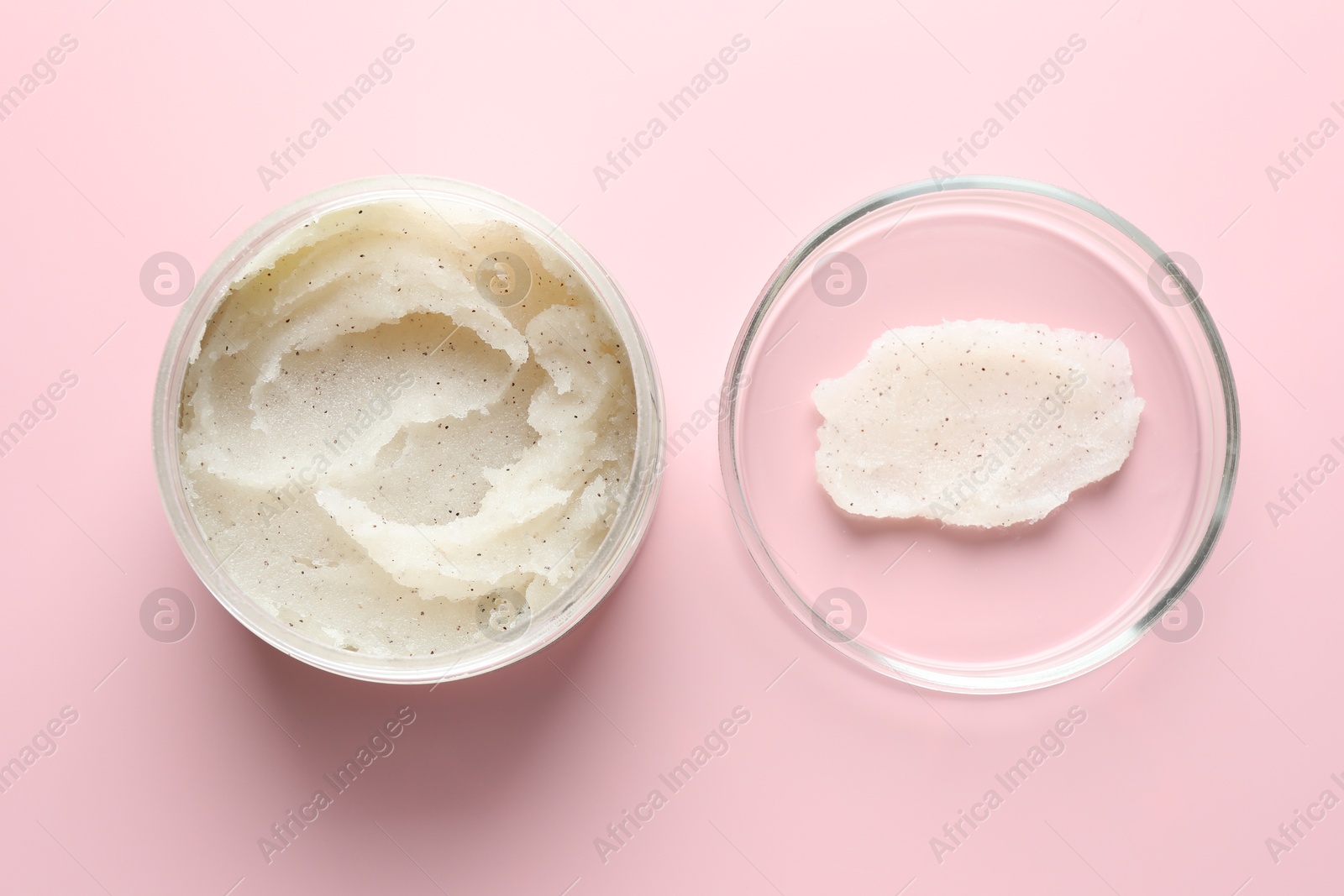 Natural scrub in Petri dish and jar of cosmetic product on pink background, flat lay Photo of Natural scrub in Petri dish and jar of cosmetic product on pink background, flat lay