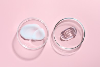 Photo of Different cosmetic products in Petri dishes on pink background, flat lay