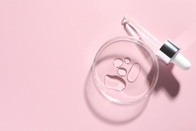 Photo of Cosmetic product in Petri dish and dropper on pink background, flat lay. Space for text