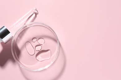 Photo of Cosmetic product in Petri dish and dropper on pink background, flat lay. Space for text