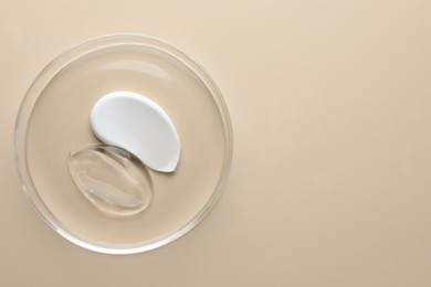 Photo of Different cosmetic products in Petri dish on beige background, top view. Space for text