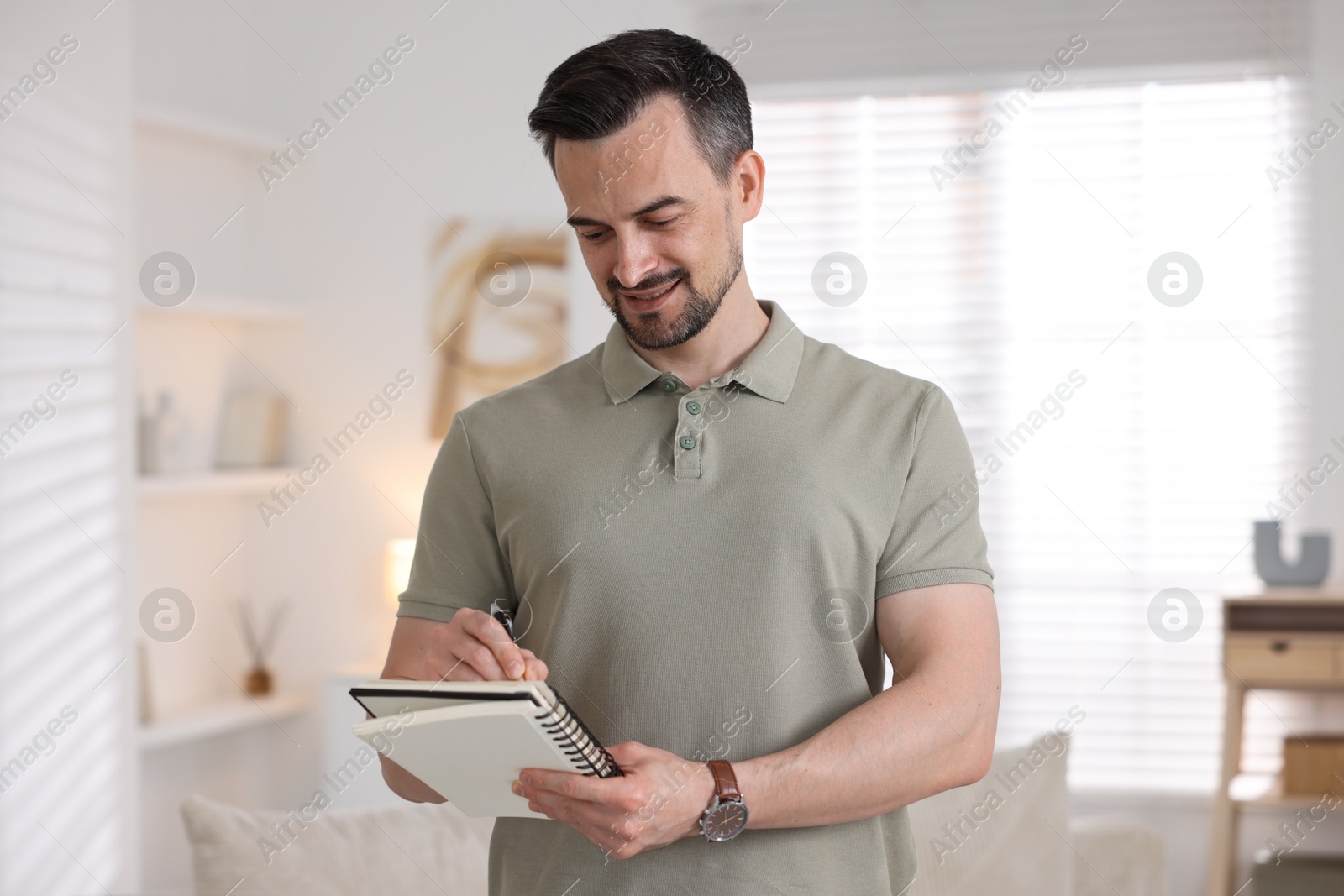 Professional psychologist with notebook in his office Photo of Professional psychologist with notebook in his office