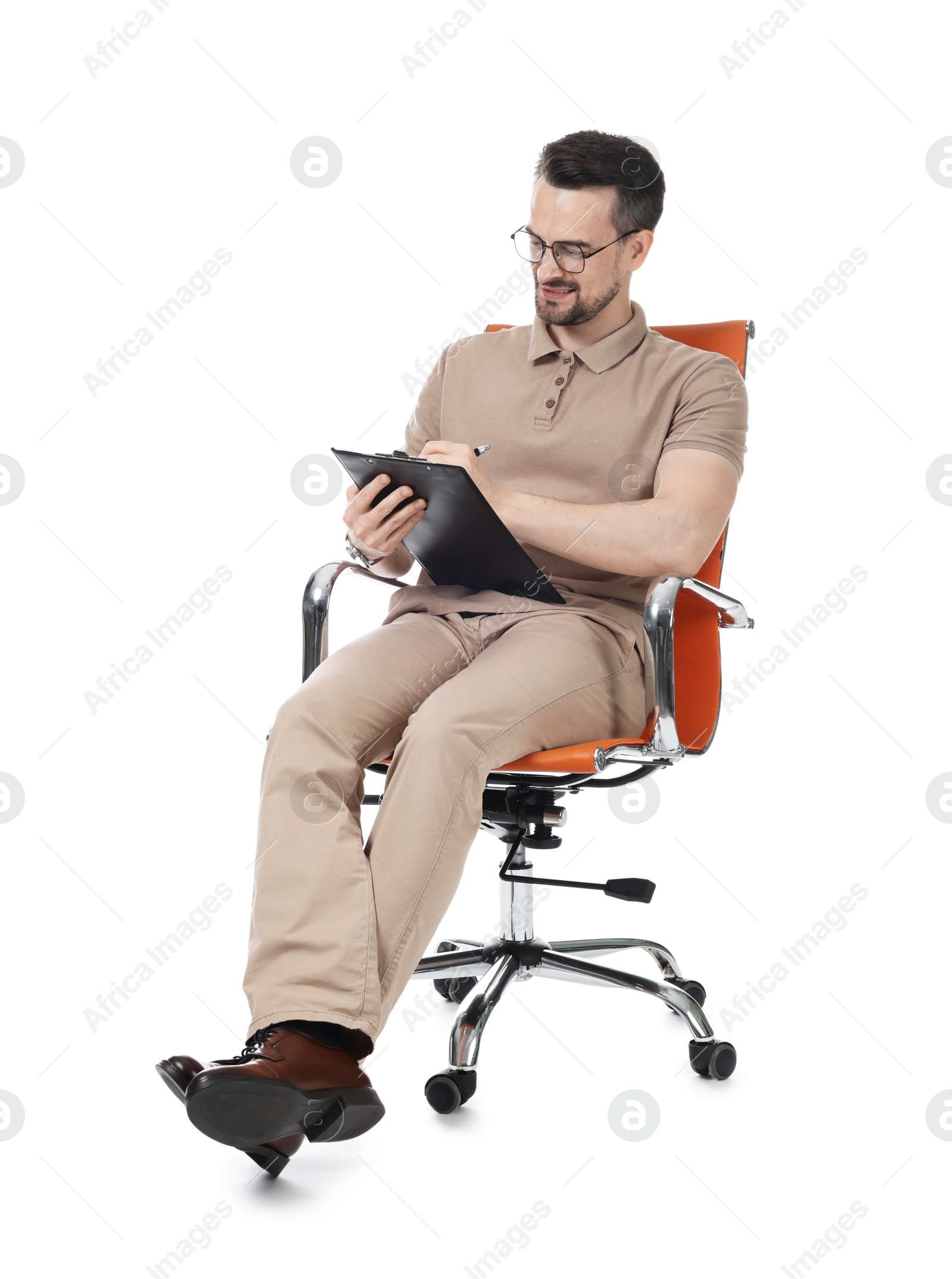 Professional psychologist with clipboard in armchair on white background Photo of Professional psychologist with clipboard in armchair on white background