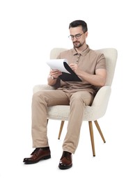 Photo of Professional psychologist with clipboard in armchair on white background