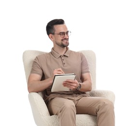 Photo of Professional psychologist with notebook in armchair on white background