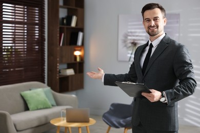 Photo of Professional psychologist with clipboard inviting to his office. Space for text