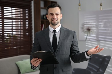 Photo of Professional psychologist with clipboard in his office