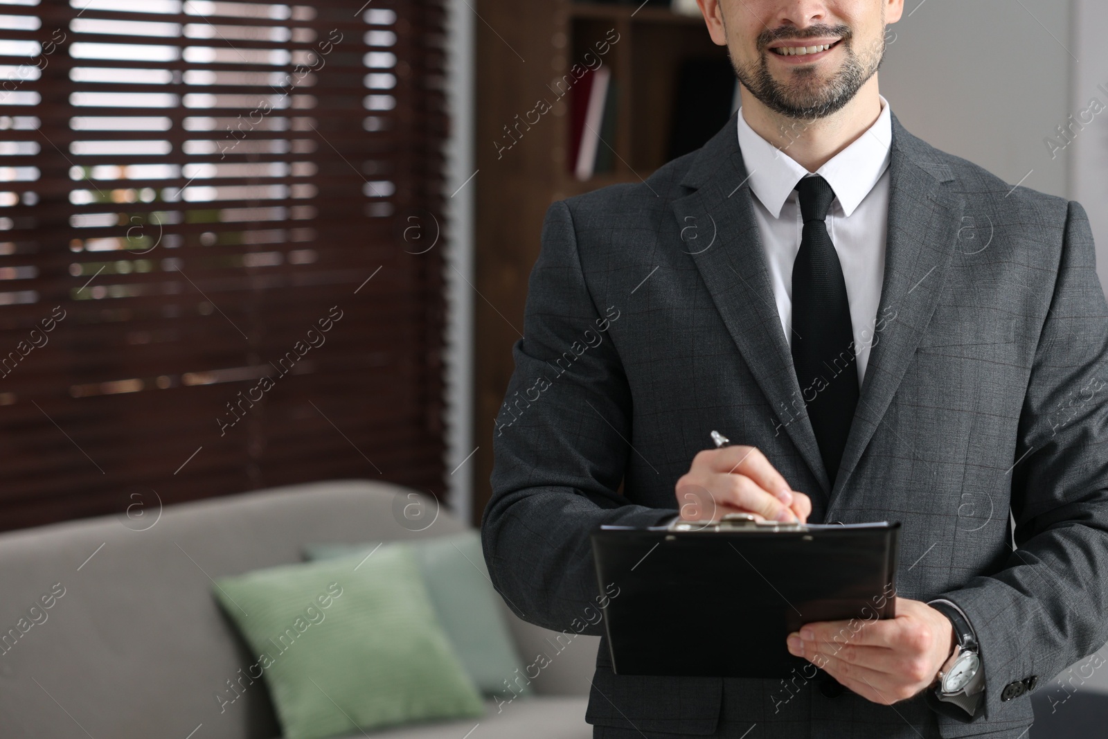 Professional psychologist with clipboard in his office, closeup. Space for text Photo of Professional psychologist with clipboard in his office, closeup. Space for text