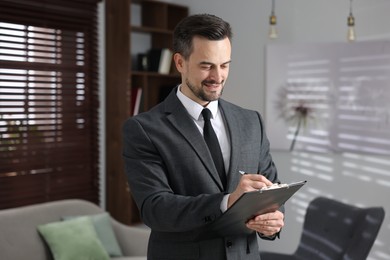 Photo of Professional psychologist with clipboard in his office