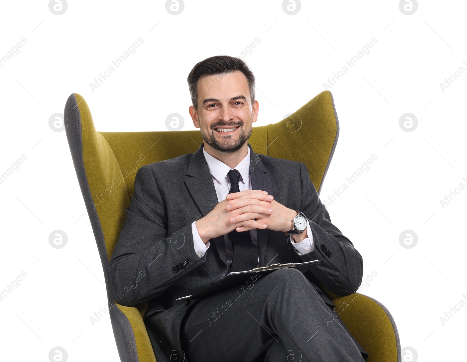 Professional psychologist with clipboard in armchair on white background Photo of Professional psychologist with clipboard in armchair on white background