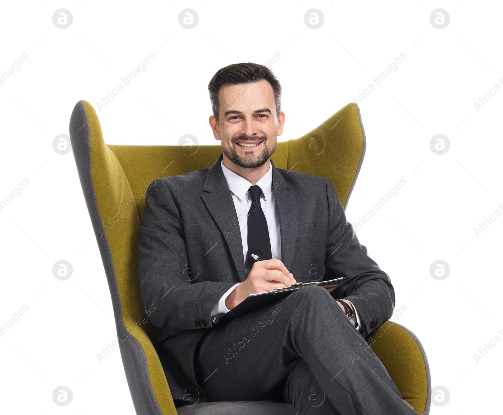 Professional psychologist with clipboard in armchair on white background Photo of Professional psychologist with clipboard in armchair on white background