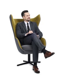 Photo of Professional psychologist with clipboard in armchair on white background