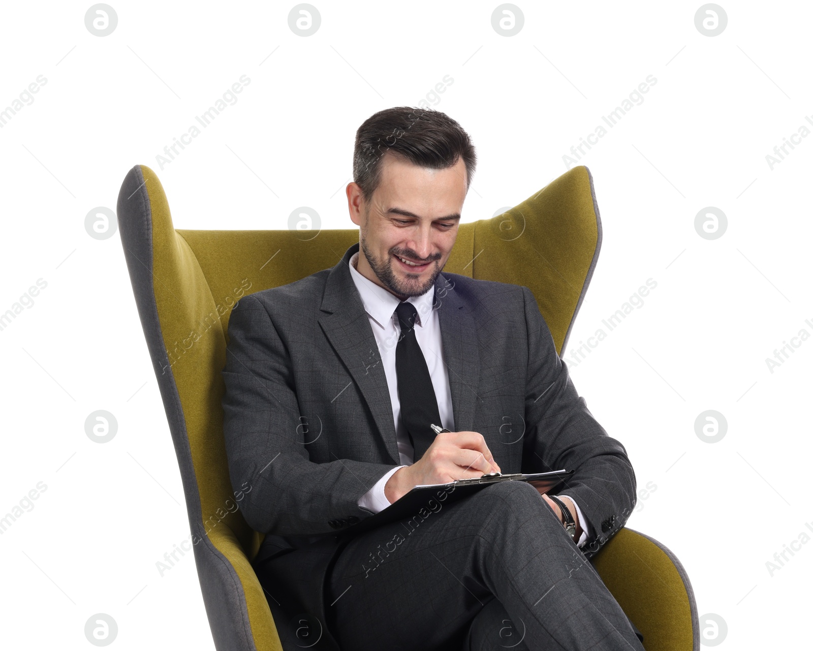Professional psychologist with clipboard in armchair on white background Photo of Professional psychologist with clipboard in armchair on white background