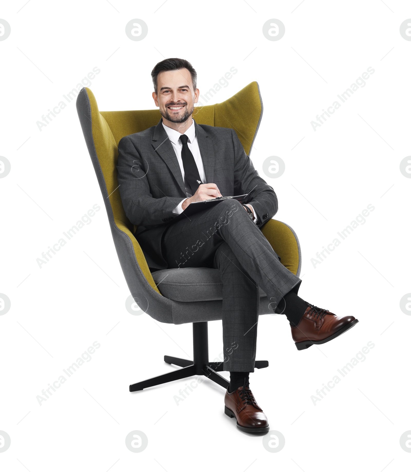 Professional psychologist with clipboard in armchair on white background Photo of Professional psychologist with clipboard in armchair on white background