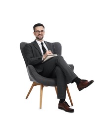 Photo of Professional psychologist with notebook in armchair on white background
