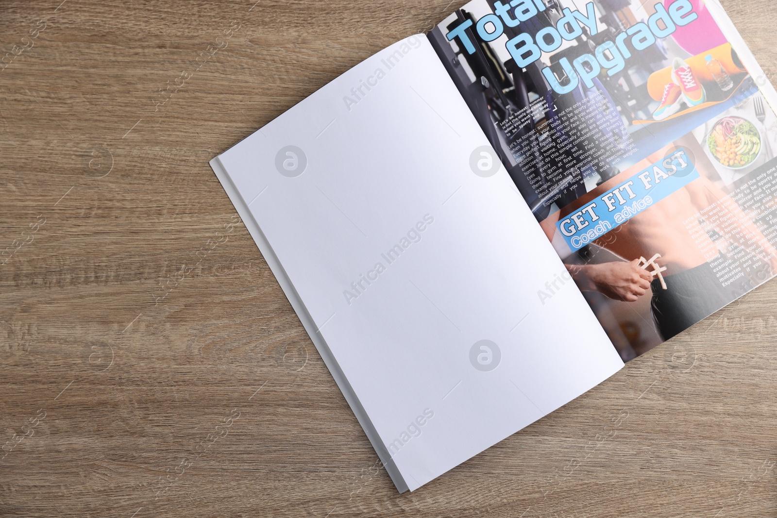 Open magazine on wooden table, top view. Mockup for design Photo of Open magazine on wooden table, top view. Mockup for design
