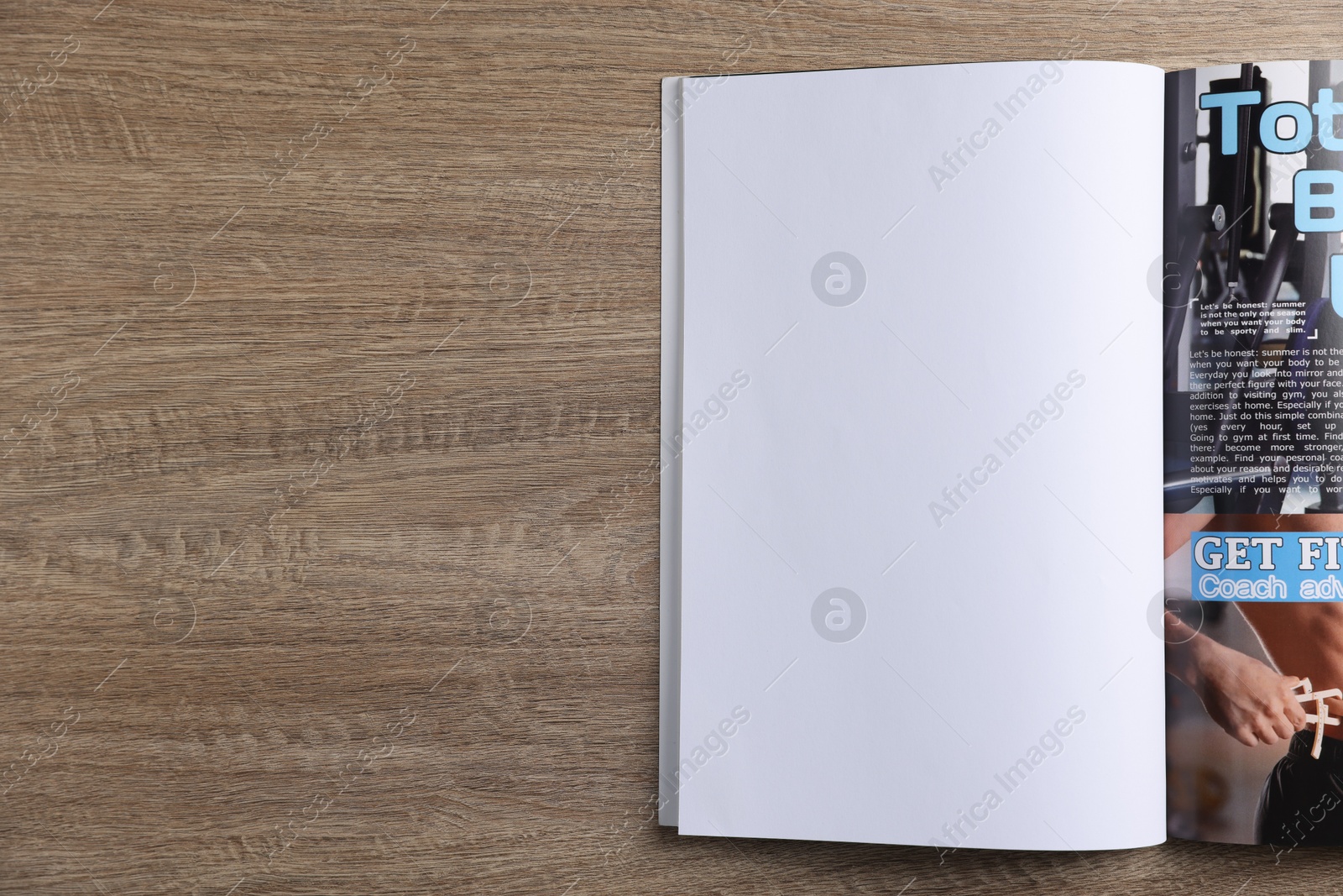 Open magazine on wooden table, top view. Mockup for design Photo of Open magazine on wooden table, top view. Mockup for design