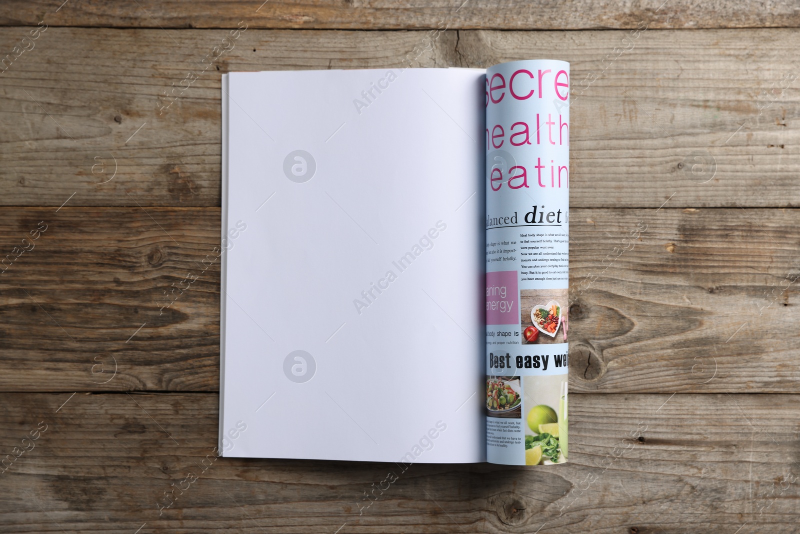 Open magazine on wooden table, top view. Mockup for design Photo of Open magazine on wooden table, top view. Mockup for design