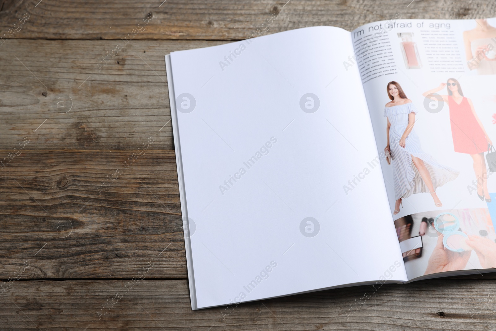 Open magazine on wooden table. Mockup for design Photo of Open magazine on wooden table. Mockup for design