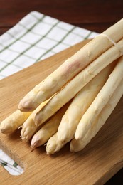 Photo of Bunch of asparagus spears on table, closeup