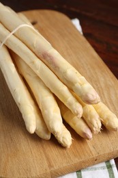 Photo of Bunch of asparagus spears on table, closeup