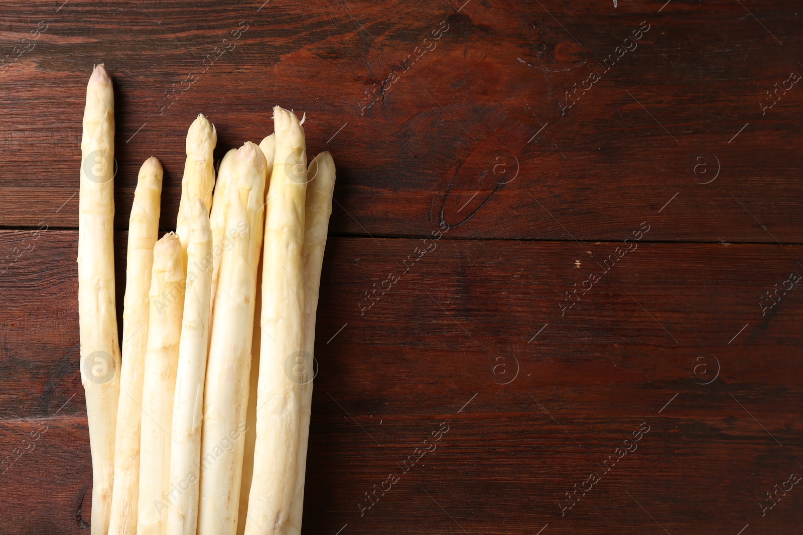 Many raw asparagus spears on wooden table, top view. Space for text Photo of Many raw asparagus spears on wooden table, top view. Space for text