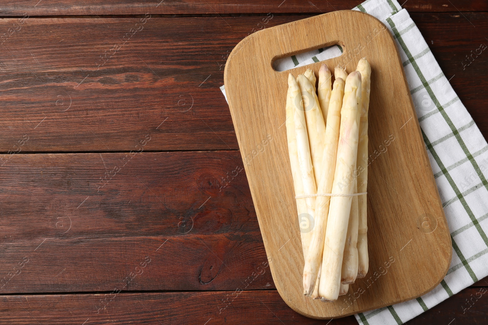 Raw asparagus spears on wooden table, top view. Space for text Photo of Raw asparagus spears on wooden table, top view. Space for text
