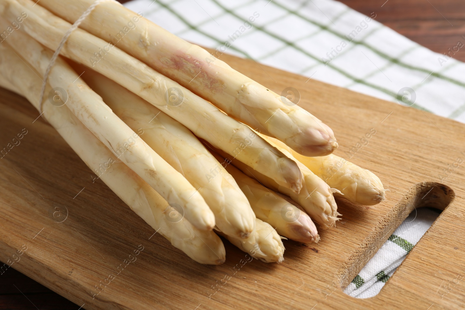 Bunch of asparagus spears on table, closeup Photo of Bunch of asparagus spears on table, closeup