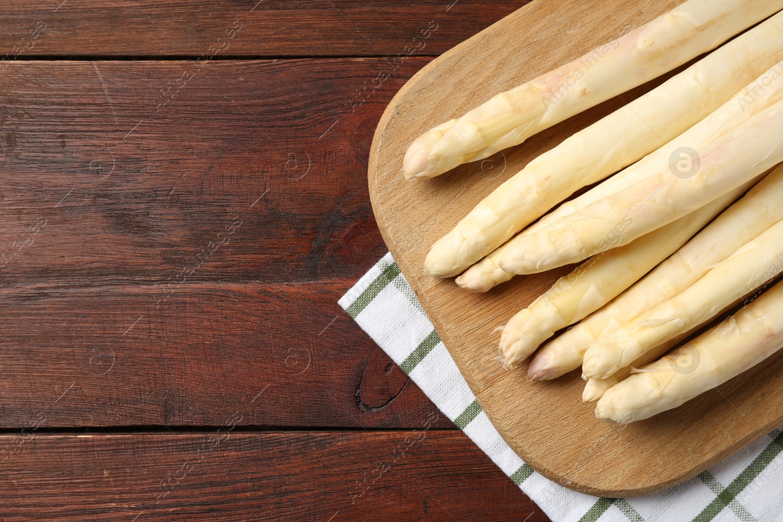 Raw asparagus spears on wooden table, top view. Space for text Photo of Raw asparagus spears on wooden table, top view. Space for text
