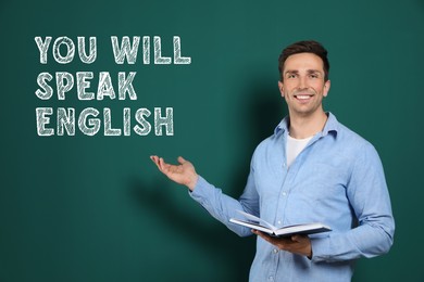 Image of Teacher pointing at text You Will Speak English on green chalkboard. Language course