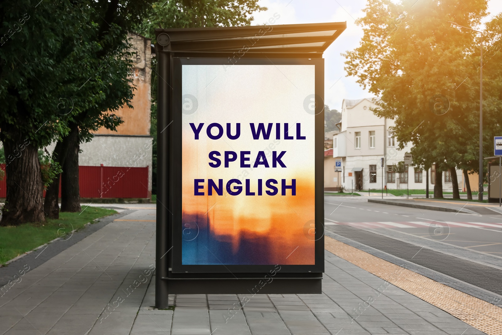 You Will Speak English text on advertising board in city. Language course Image of You Will Speak English text on advertising board in city. Language course